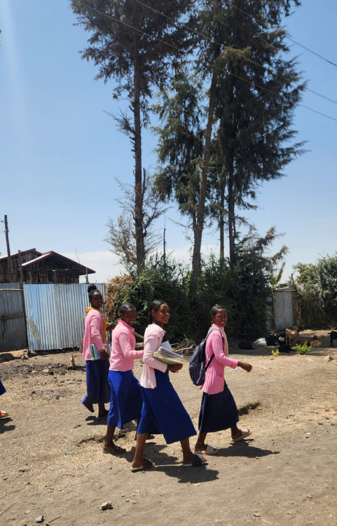 Schoolgirls (and boys) walk for miles and miles with smiles and fascination about us.