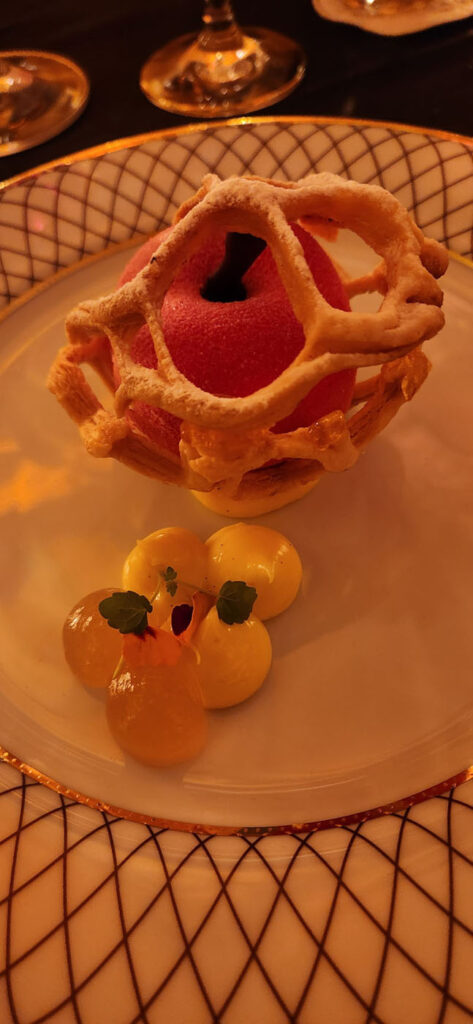 Exquisite gala dessert. Riff on Apfel in Schlafrock or Apple in a Nightgown. A creamy apple-shaped orb in lattice dough with multi flavored gelee pearls.