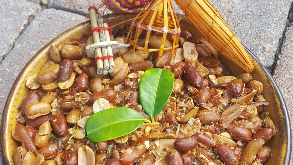 Lao roasted peanuts with kaffir lime leaf garnish and Lao lucky charm