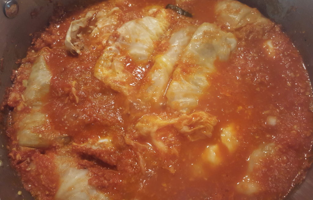 Stuffed cabbage rolls simmering in the pot.