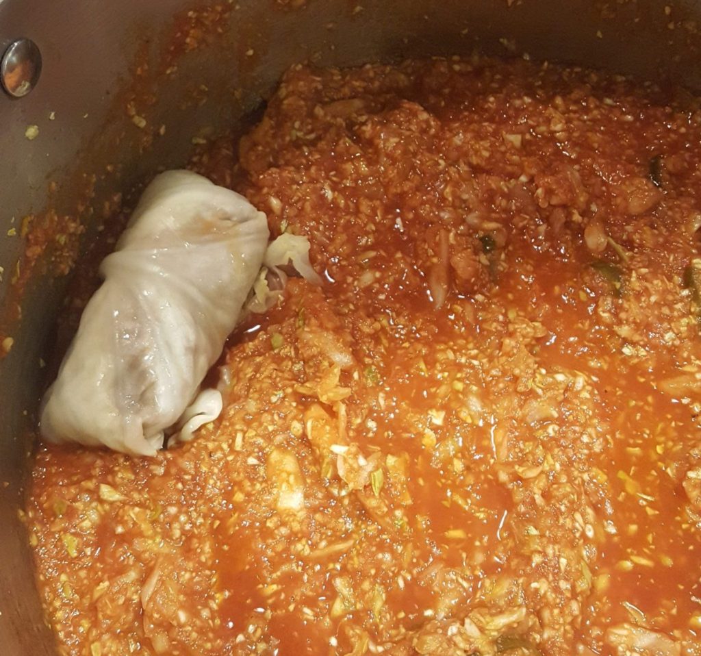 Each cabbage roll is placed seam side down in pan with sauce.