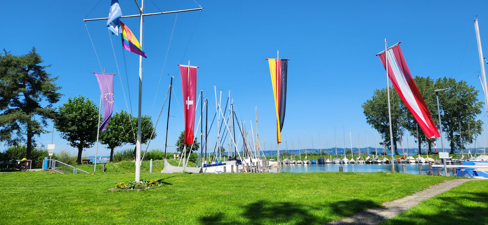 Flags of EU, Switzerland, Germany and Austria at the shared lake Konstanz.
