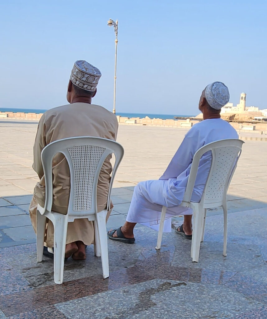 Men wearing traditional Omani Kuma headpiece.